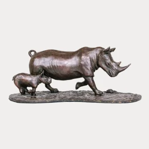 Bronze sculpture of a mother rhino walking with her calf, symbolizing resilience and protection.