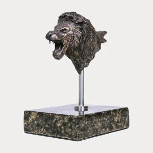 Bronze lion bust sculpture on a marble base, roaring with open mouth and detailed mane.