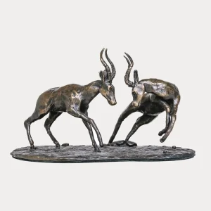 Bronze sculpture of two impala rams locking horns in a fierce rutting battle.